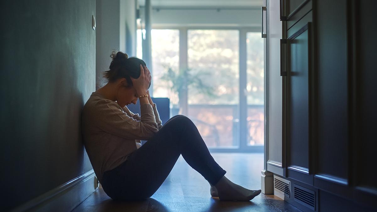 Article Cards Featured Image grief overload woman in hallway