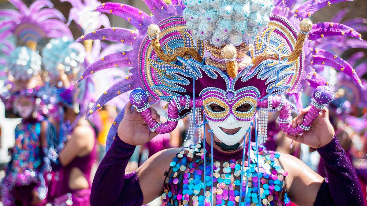 Article Cards Featured Image Masskara Festival street dance parade participant facing the  camera.