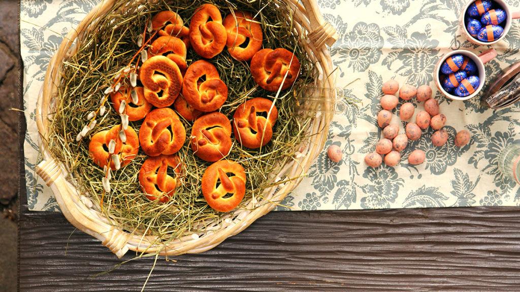 Photo of soft pretzels in a basket with Easter eggs and chocolates