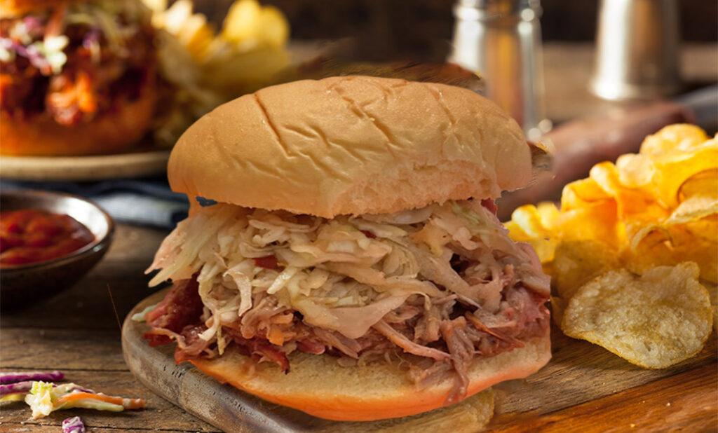 Wines for tailgating with a pulled pork sandwich.