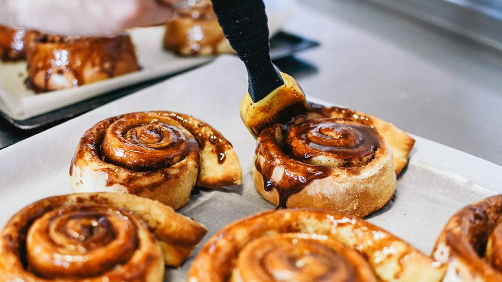 Cinnamon buns being made.